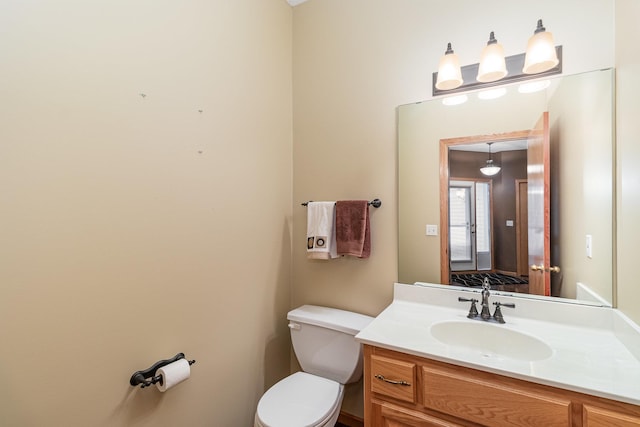 bathroom with toilet and vanity