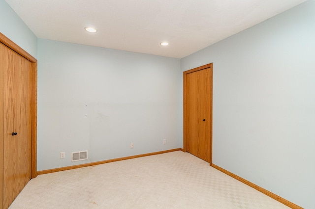 unfurnished bedroom featuring carpet floors and a closet