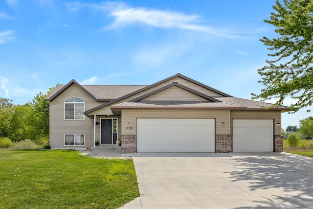 view of front of house with a front lawn and a garage