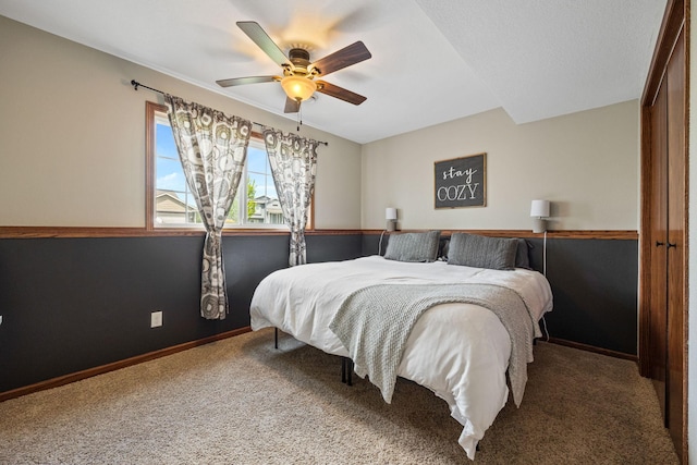 bedroom featuring carpet floors, ceiling fan, and a closet