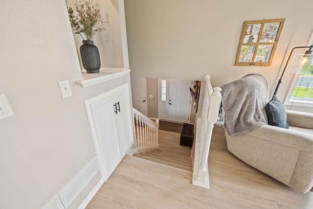 staircase featuring wood-type flooring