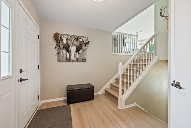 foyer with light hardwood / wood-style floors