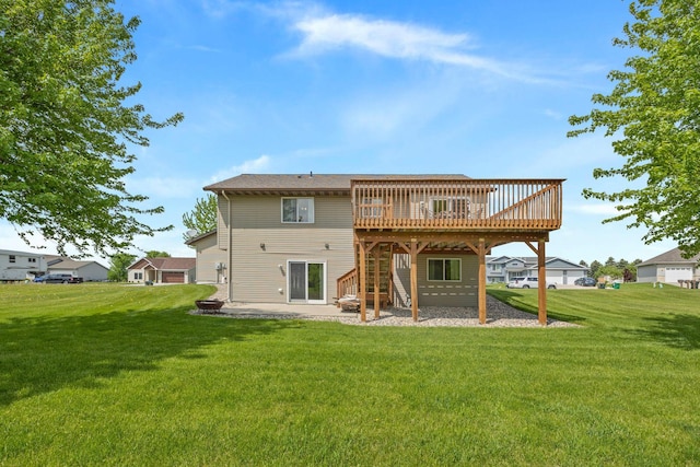 back of house with a lawn, a patio, and a wooden deck