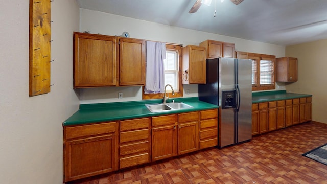 kitchen with ceiling fan, stainless steel fridge with ice dispenser, sink, and parquet floors