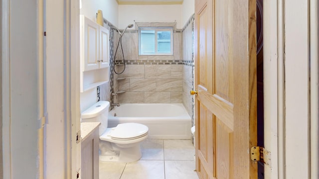 full bathroom with toilet, vanity, tile patterned floors, and tiled shower / bath