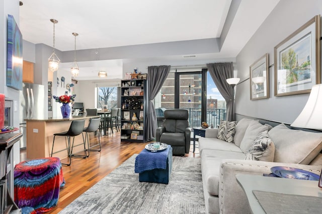 living room with light hardwood / wood-style flooring