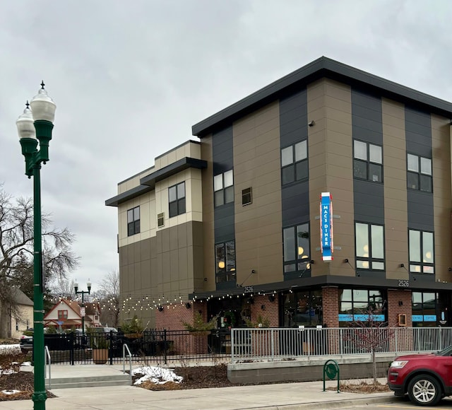 view of building exterior featuring fence