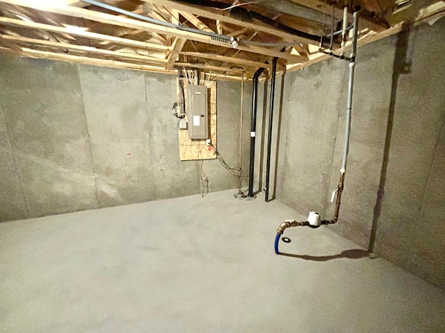 unfinished basement featuring electric panel