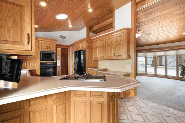 kitchen featuring kitchen peninsula, light colored carpet, ceiling fan, black appliances, and wooden ceiling