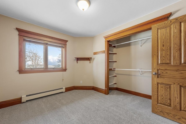 unfurnished bedroom with light carpet, a closet, and a baseboard heating unit