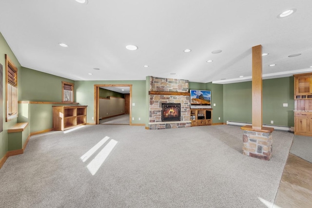 carpeted living room featuring a fireplace and a baseboard radiator