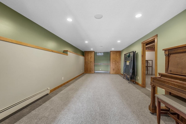 living room with light colored carpet and a baseboard heating unit