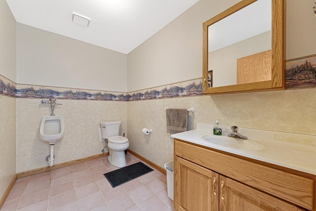 bathroom featuring tile patterned flooring, vanity, toilet, and lofted ceiling