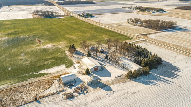 birds eye view of property with a rural view