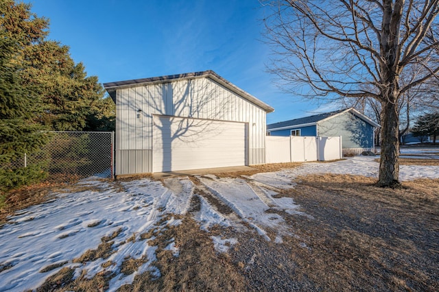 view of snow covered garage