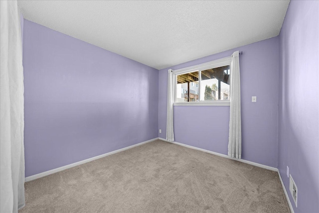 8907 Ironwood Ave S, Cottage Grove, MN 55016 - carpeted empty room featuring a textured ceiling, visible vents, and baseboards
