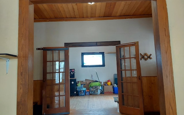 interior space with wood ceiling and wood finished floors