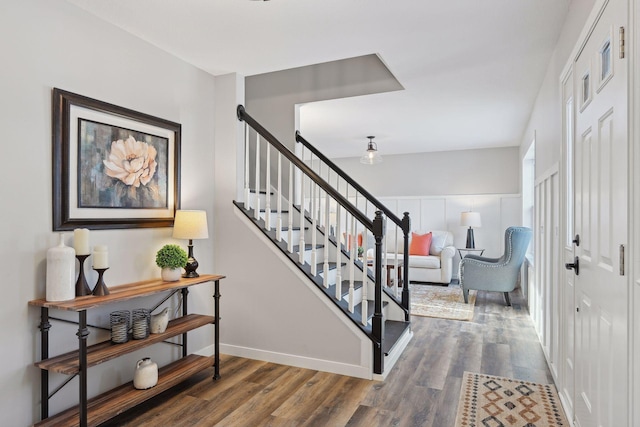 stairs featuring hardwood / wood-style flooring