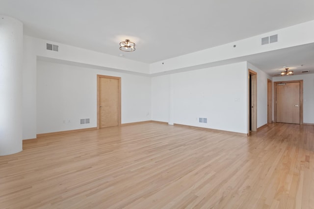 spare room featuring light hardwood / wood-style flooring