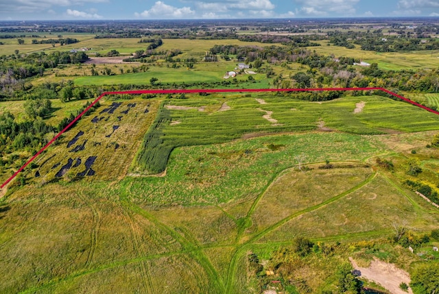 birds eye view of property featuring a rural view