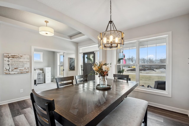 dining space featuring plenty of natural light, baseboards, and dark wood-style flooring