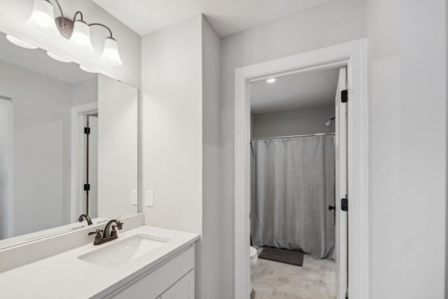 full bathroom with vanity, toilet, and a shower with curtain