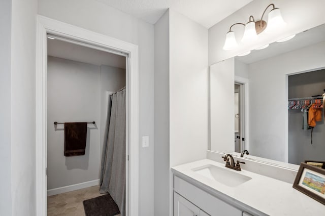 bathroom featuring vanity and baseboards