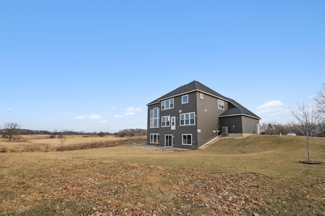 back of house with a yard