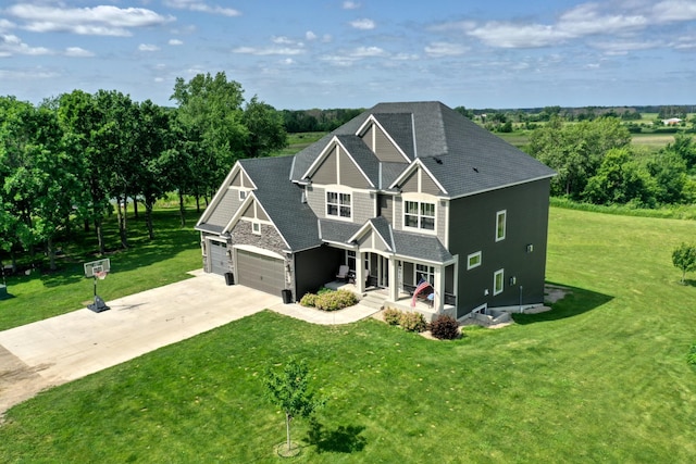 18340 Forest Rd N, Forest Lake, MN 55025 - craftsman-style house with covered porch, a front yard, concrete driveway, and roof with shingles