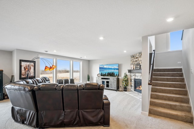 18340 Forest Rd N, Forest Lake, MN 55025 - living room with a stone fireplace, light colored carpet, recessed lighting, stairs, and healthy amount of natural light