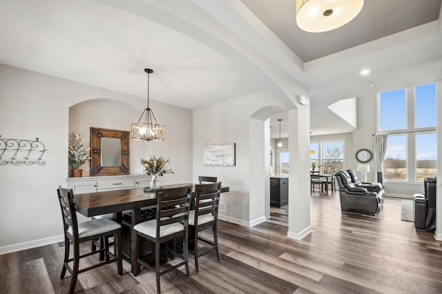 18340 Forest Rd N, Forest Lake, MN 55025 - dining room featuring arched walkways, dark wood-style flooring, a chandelier, and recessed lighting