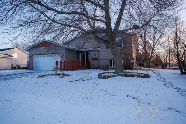 view of front of home featuring brick siding and an attached garage