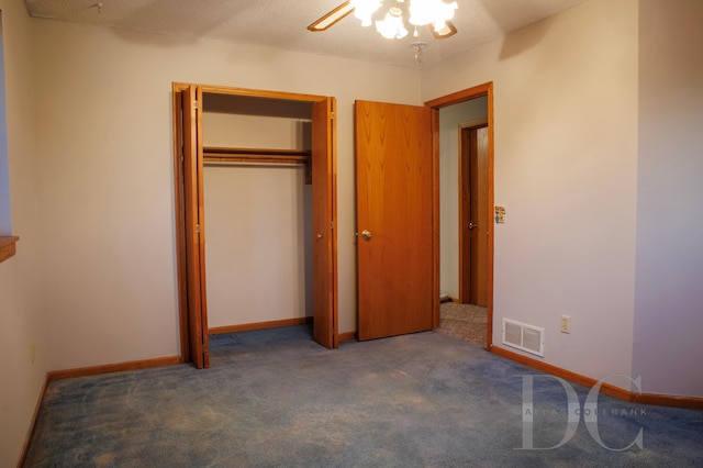 unfurnished bedroom with a closet, carpet flooring, visible vents, and baseboards