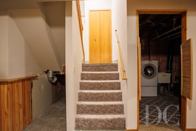 stairs featuring washer / clothes dryer