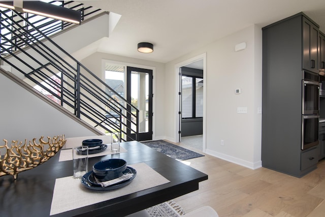 entryway with light hardwood / wood-style flooring