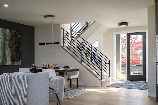 entryway with hardwood / wood-style floors