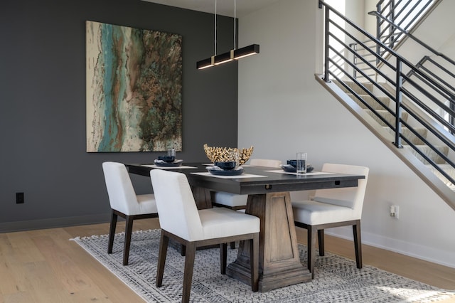 dining area with light hardwood / wood-style flooring