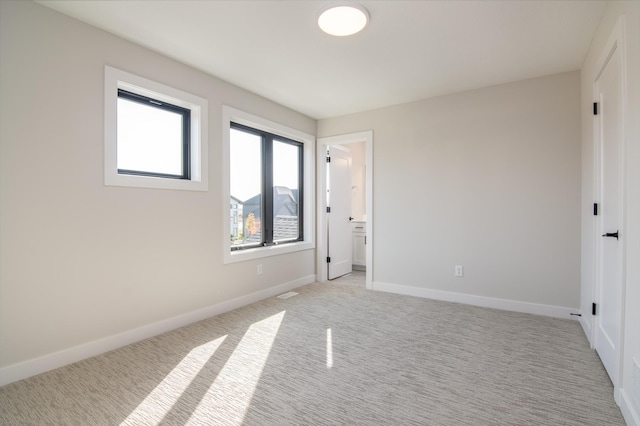 unfurnished bedroom with light carpet