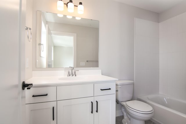 full bathroom with vanity, tiled shower / bath combo, and toilet