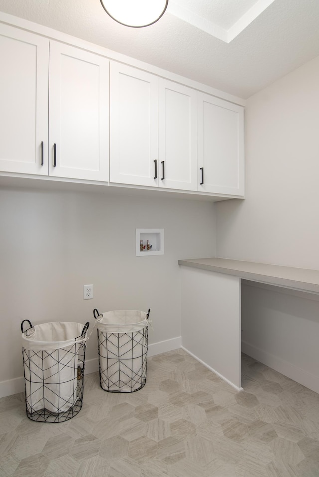 washroom featuring cabinets and hookup for a washing machine