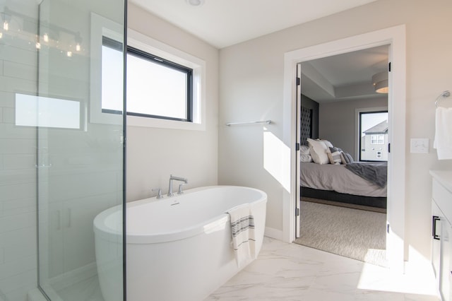 bathroom featuring vanity and shower with separate bathtub