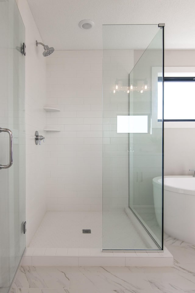 bathroom with independent shower and bath