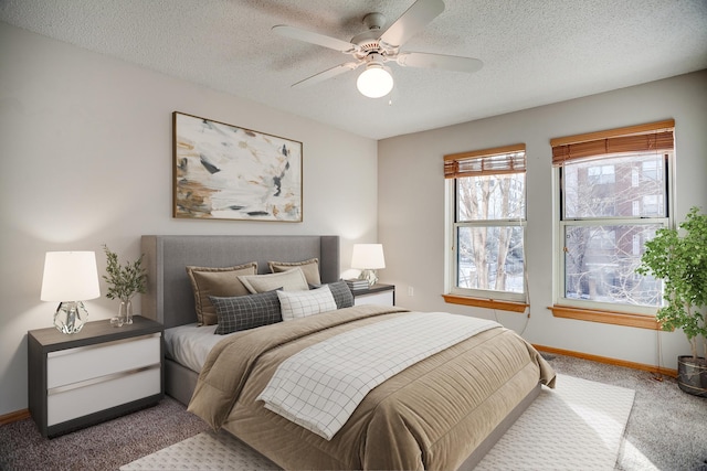 bedroom with light carpet, a textured ceiling, and ceiling fan