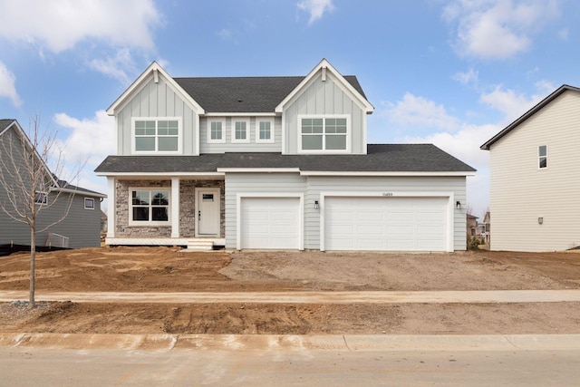 11459 Blazingstar Ln, Lake Elmo, MN 55042 - craftsman-style house featuring board and batten siding, a porch, an attached garage, and driveway