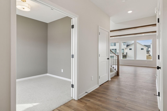11459 Blazingstar Ln, Lake Elmo, MN 55042 - hall with wood finished floors, stairway, baseboards, and recessed lighting