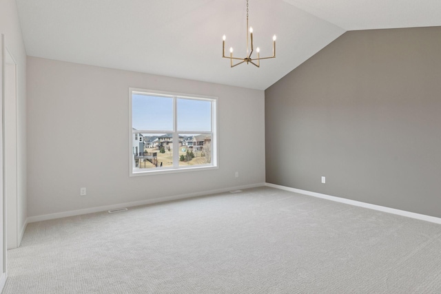 11459 Blazingstar Ln, Lake Elmo, MN 55042 - empty room featuring lofted ceiling, a chandelier, carpet, and baseboards