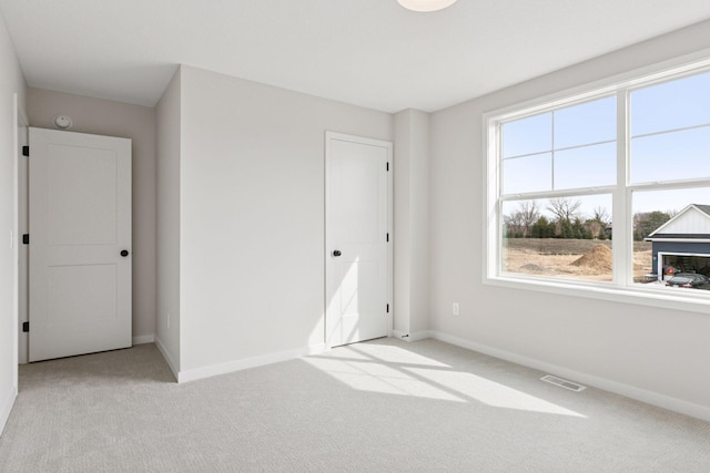 11459 Blazingstar Ln, Lake Elmo, MN 55042 - unfurnished bedroom with light carpet and baseboards