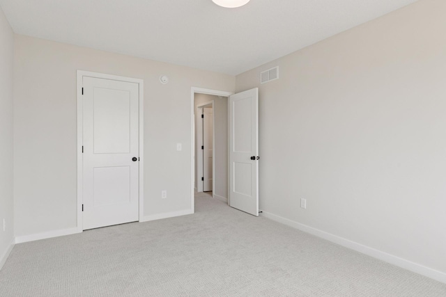 11459 Blazingstar Ln, Lake Elmo, MN 55042 - unfurnished bedroom featuring light colored carpet and baseboards