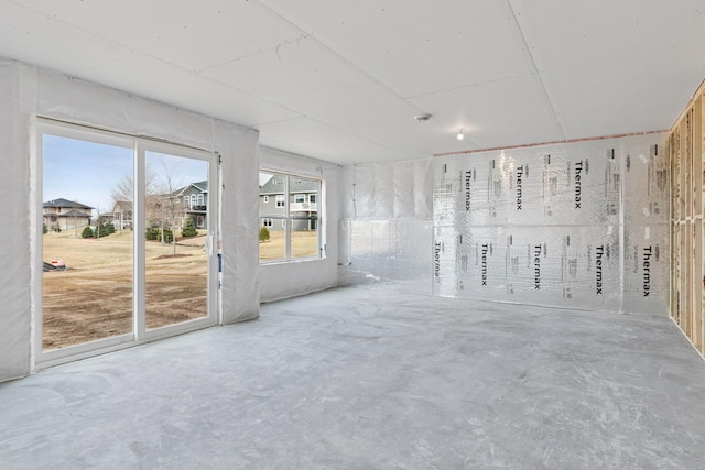 11459 Blazingstar Ln, Lake Elmo, MN 55042 - empty room featuring concrete floors