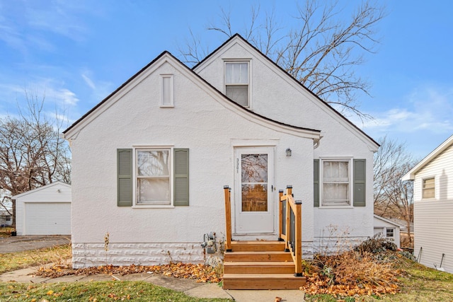 view of front of home with an outbuilding and a garage